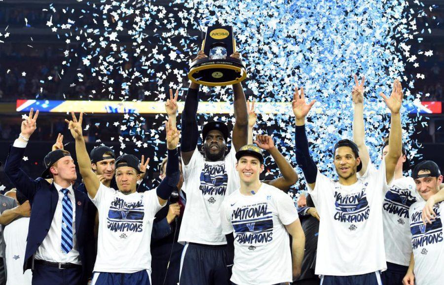 Villanova Wildcats forward Daniel Ochefu hoists the national championship trophy with teammates after defeating the North Carolina Tar Heels in the championship game of the 2016 NCAA Mens Final Four at NRG Stadium, April 4, 2016.
