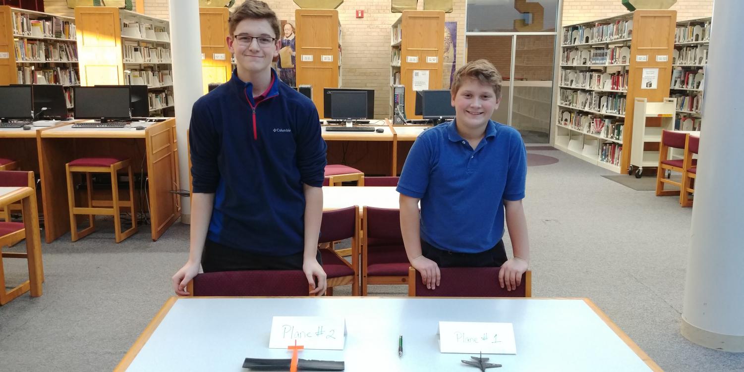 Joe Malo, '21, (left) and Charlie Conley, '21, await judging of their 3-D airplanes Nov. 30.